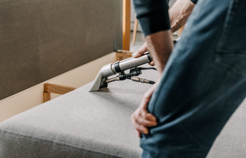 Professional cleaning service deep cleaning sofa at home.
